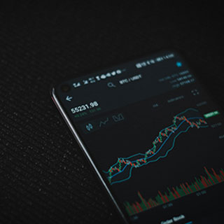 Photo of financial data on a phone screen