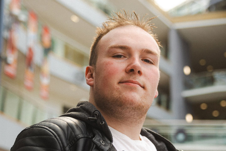 Cory, an undergraduate in BSc Game Design and Development, smiling at the camera on University of Bradford campus