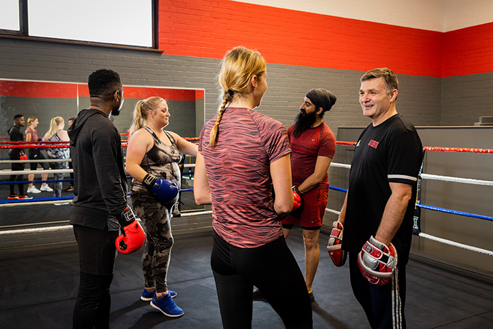 Students taking part in a boxing class at Unique Fitness