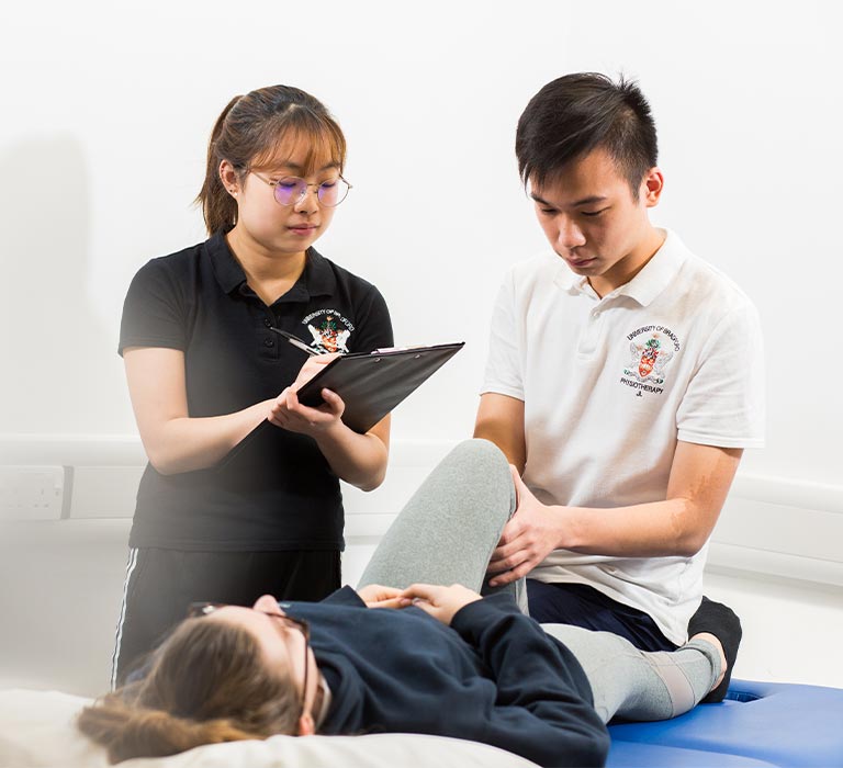 A person observing a physiotherapy session.