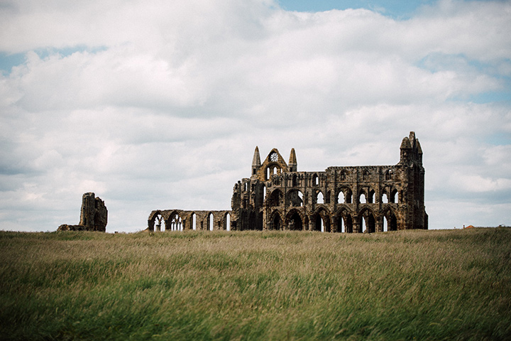 Whitby Abbey on a cloudy day, by Lison Zhao on Unsplash