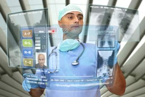 image of doctor working with transparent digital screens