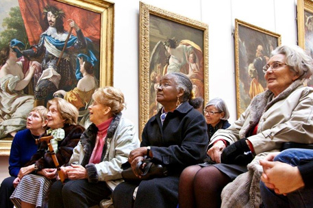 Elderly people at an art gallery. Copyright Cathy Greenblat photography.