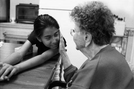 A female dementia patient with a young girl. Grid box size.