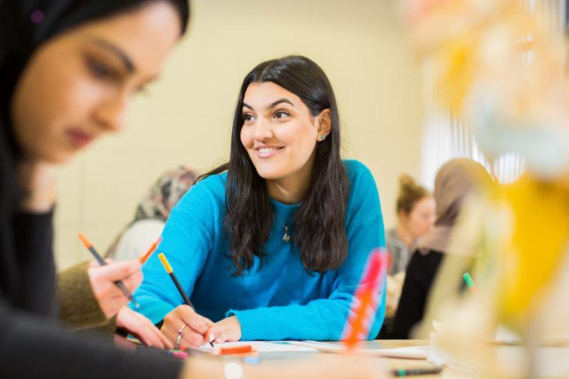 Smiling student studying