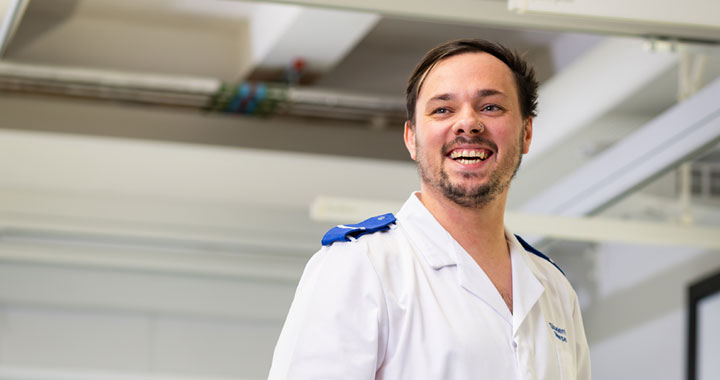 A smiling student wearing nursing uniform.