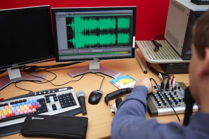 Image of a computer with audio equipment