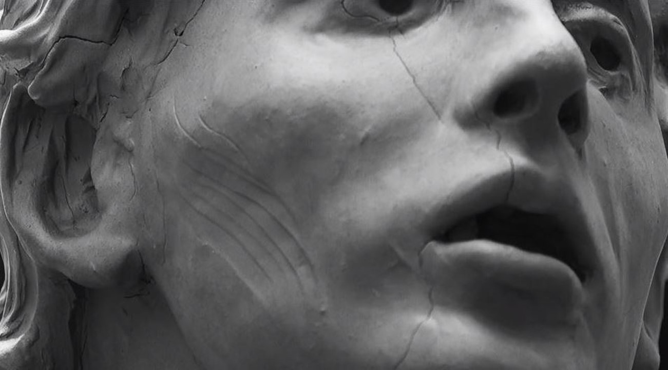 A close-up shot of a statue's face