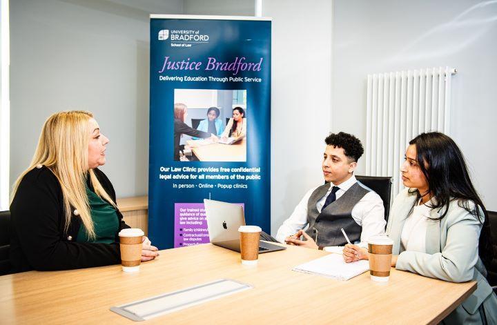 Students engaged in School of Law Clinic session with guest for Justice Bradford