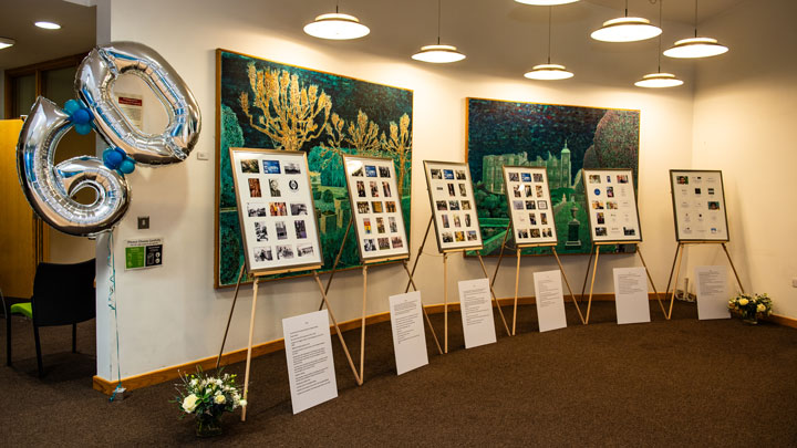 History stands displaying photos and information on the history of the School of Management at the Annual Management Lecture
