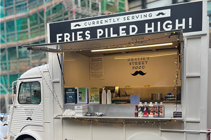 Bertie Street Food van parked outside on campus, ready to serve food. The van features a banner stating 