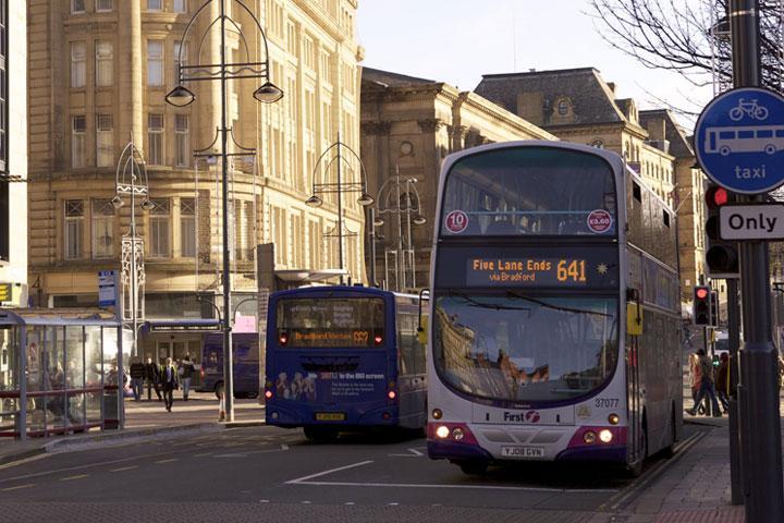 A bus on a busy road in the centre of Bradford.