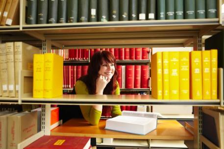 A student using journals in the library