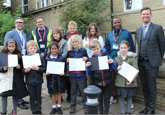 Pupils at Saltaire Primary with University of Bradford academics and students