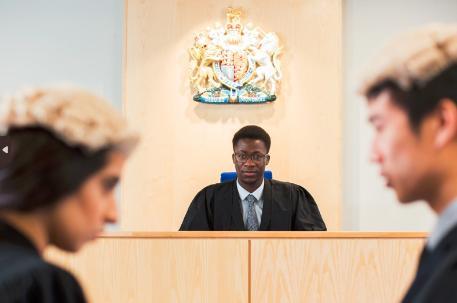 Students acting as barristers in mock court room