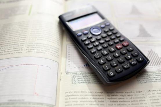 Maths calculator on a desk of papers