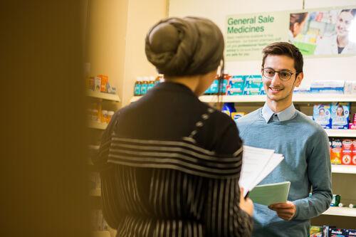 Student pharmacist practising engaging with a customer